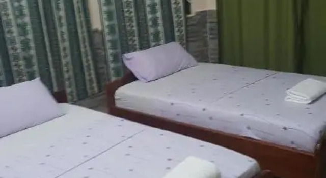 Кровать в общем номере Wli Water Heights Hotel