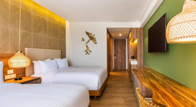 Четырёхместный номер Standard с балконом и с частичным видом на океан Santa Marta Marriott Resort Playa Dormida