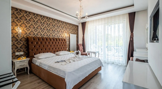 Трёхместный номер Deluxe с балконом Assos Ayan Motel
