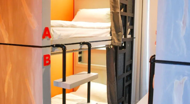 Кровать в общем номере Zula Residences