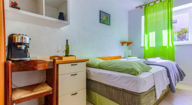 Студия Apartments Filipovic with garden