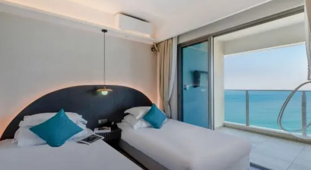 Люкс с 2 комнатами с балконом и рядом с пляжем Baoli JintinShanwei Bay Dongyue Boyang apartment