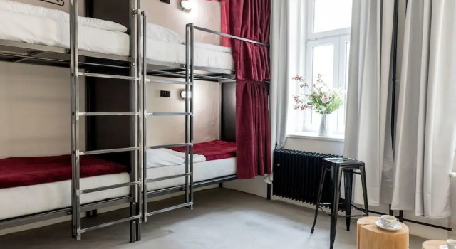 Кровать в общем номере с видом на внутренний двор Wake Up Wellness Hostel by goodnite cz