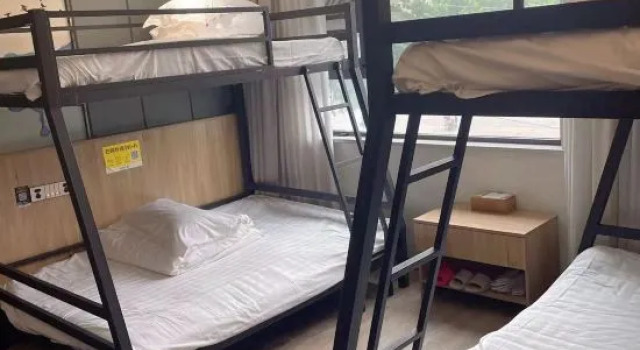 Кровать в общем номере Xiyue Boutique Hotel