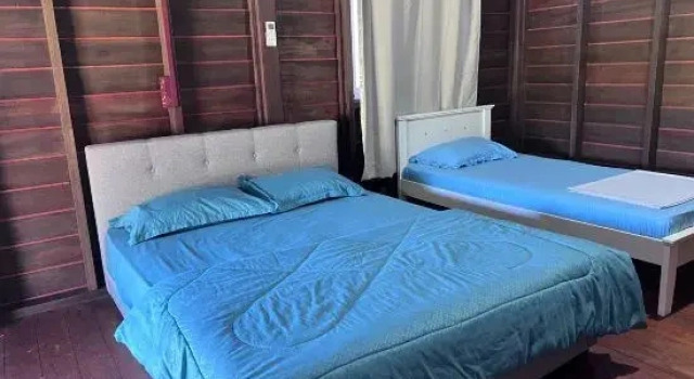 Трёхместный люкс Hotel O Sri Ayu Inn