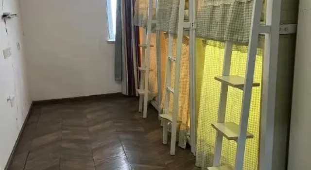 Кровать в общем номере Hangzhou Hamigua Hotel