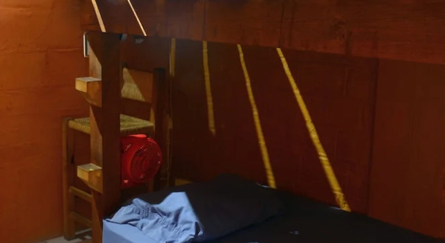 Кровать в общем номере Hostal San Pancho