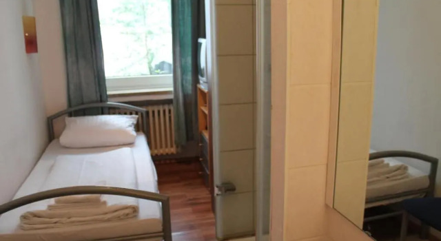 Кровать в общем номере Hotel Lilienhof