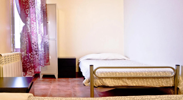 Кровать в общем номере Las Musas Residence