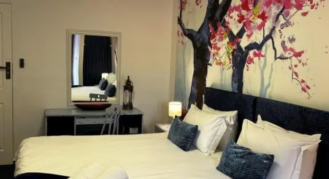 Luxo quarto Be at Rest Accommodation