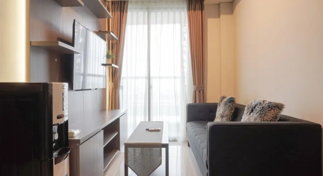 Апартаменты Comfortable and Minimalist 2BR at Gold Coast Apartment By Travelio