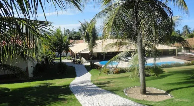 Кровать в общем номере Hotel Villaggio Tudo Bom