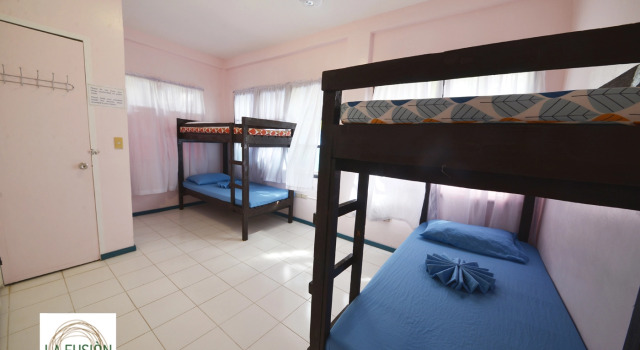 Кровать в общем номере La Fusion Garden Resort