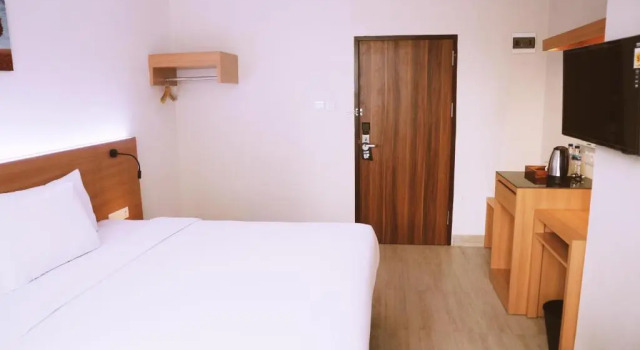 Номер Deluxe Grand Thamrin Hotel