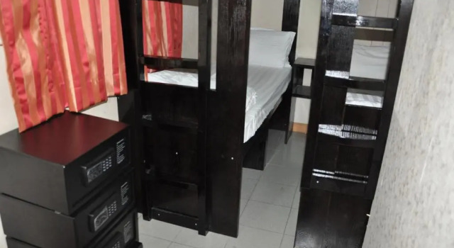 Кровать в общем номере New Guangzhou Guest House