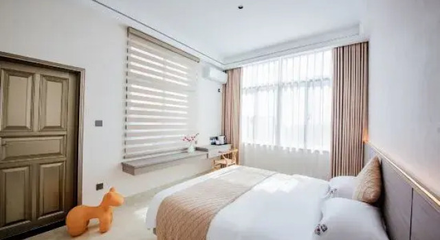 Двухместный семейный люкс с балконом Meizhoudao Zhaoxi Chaoxi Homestay (Lianchiao Shatan Beach)