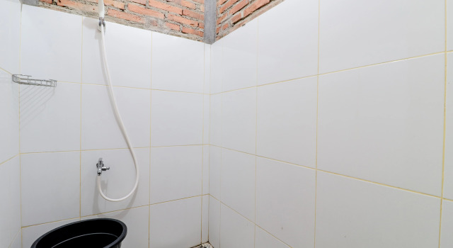 Cama en dormitorio compartido d'Hasinda Homestay