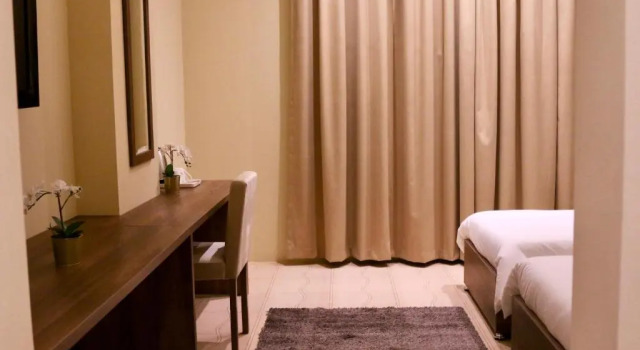 Vuode makuusalissa Qatar Youth Hostels