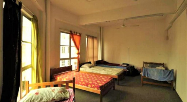 Кровать в общем номере Le Village Malacca Guest House