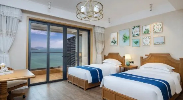 Люкс с 3 комнатами с видом на море Wanning Riyuewan Shangyi Seaview Surf Apartment