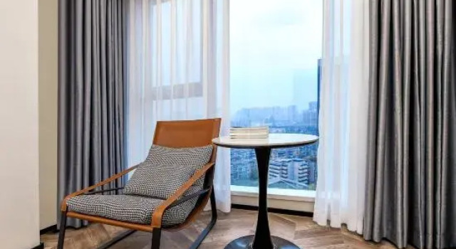 Кровать в общем номере с красивым видом из окна Chengdu Cheerfl Courtyard Hotel