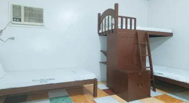 Кровать в общем номере Villa Del Carmen Resort & Restaurant by RedDoorz