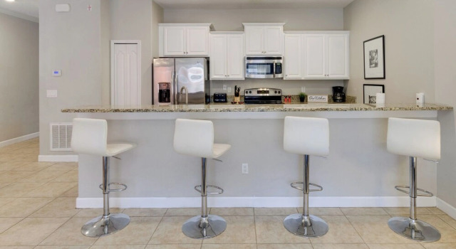 Апартаменты Modern Kissimmee Townhome with Fenced Pool and Patio