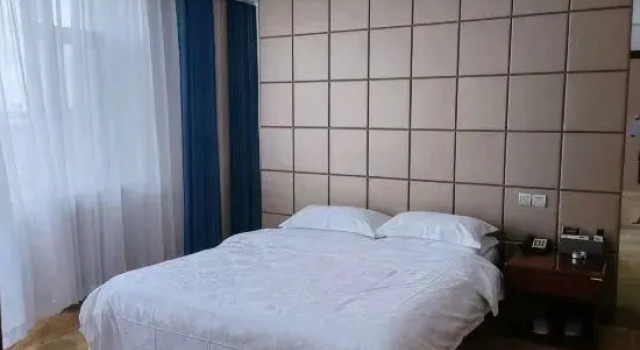 Семейный люкс Jijia Business Hotel (Hailin High-Speed Railway North Station)