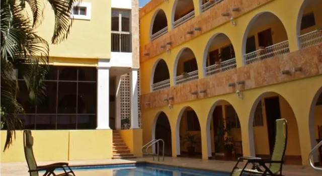 Кровать в общем номере Hotel Maya Yucatan