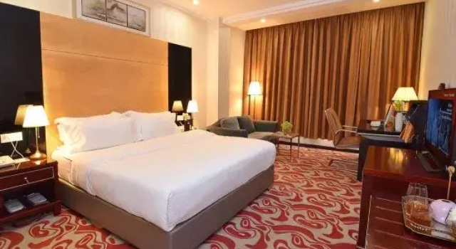 Кровать в общем номере Kelly Hotel (Guangzhou Zengcheng Xintang South Station)