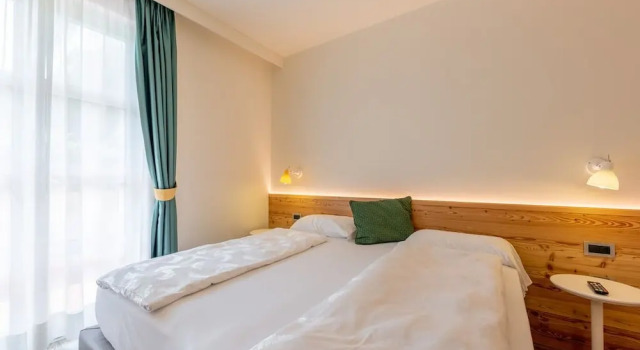 Четырёхместный номер Comfort Alpholiday Dolomiti Wellness & Family Hotel