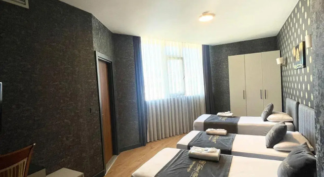 Standardowy trzyosobowy pokój HMZ Luxury Hotel