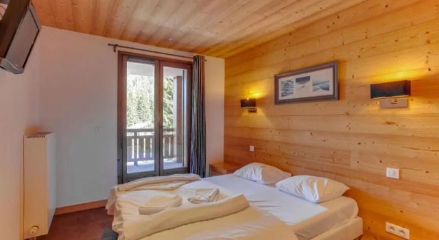 Кровать в общем номере Пентхаус с 2 комнатами Dormio Resort Les Portes du Mont Blanc