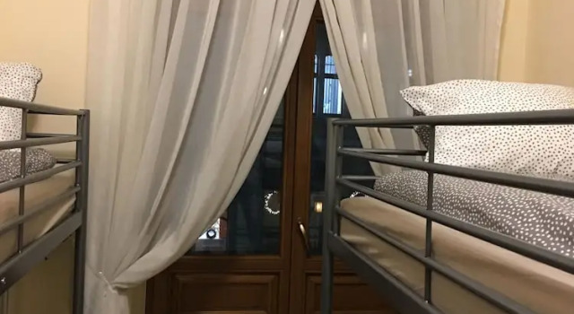 Кровать в общем номере Ametyst Apartments