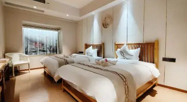 Sijichuntian Hotel, Boek Hotel Qionghai Hainan
