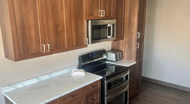 Коттедж с 3 комнатами с видом на залив Howey Bay Motel