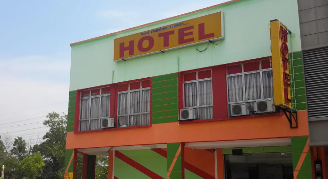 Кровать в общем номере Bukit Beruntung Business Hotel