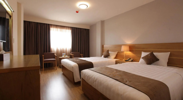 Трёхместный номер Deluxe Minh Tam Hotel & Spa 3/2
