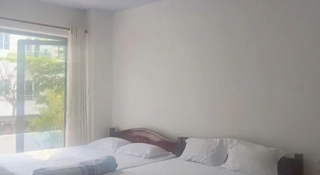 Четырёхместный номер Deluxe с балконом HOTEL MOTeL ĐỒNG KHỞI