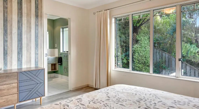 Cheerful 4 bedroom home with free parking.