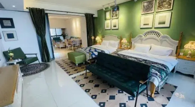 Семейный люкс Deluxe с 3 комнатами с видом на море Beihai Huanan Thematic Scenic Apartment (Beihai Golden Beach Beibu Bay No.1)