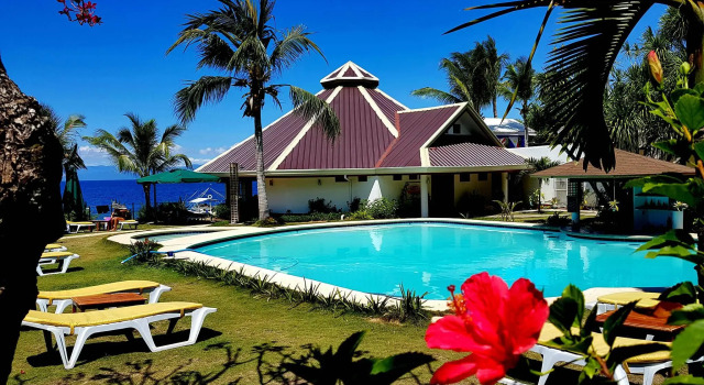 Кровать в общем номере Quo Vadis Dive Resort