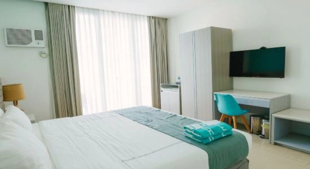 Четырёхместный номер Deluxe с видом на бассейн Club Samal Resorts Development Inc