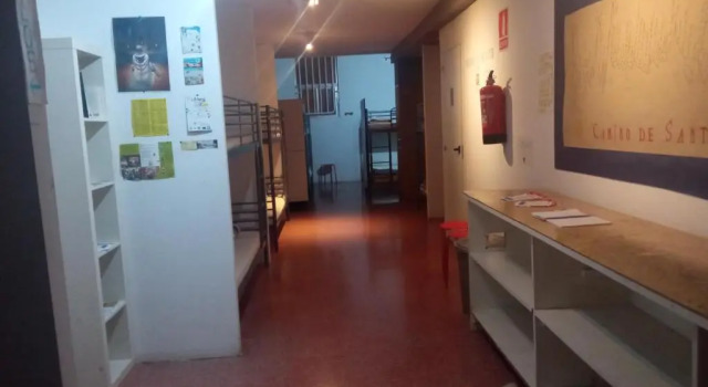 Кровать в общем номере Albergue El Peregrino