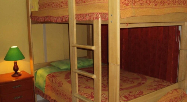 Cama em dormitório Nasca Lodge