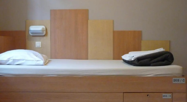 Кровать в общем номере Sleep Well Youth Hostel