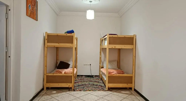 Кровать в общем номере Afgo Hostel