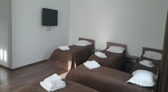 Кровать в общем номере Sweet House Guest house