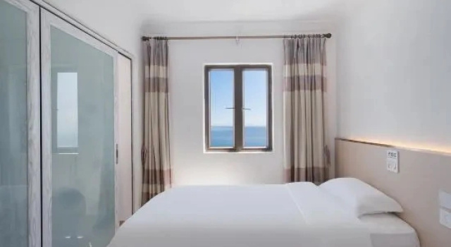 Люкс с 2 комнатами с видом на море Shuangyuewan Yikela Holiday Apartment