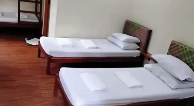 Кровать в общем номере Camiguin Lanzones Resort